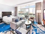 Family with sofa bed room with sea view