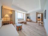 Deluxe Quadruple Suite with balcony and with partial sea view