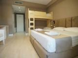 Standard Quadruple room with balcony and with partial sea view