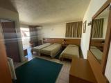 Standard Triple room with garden view