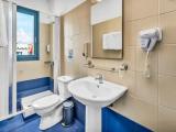 Standard Triple room with garden view