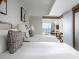1 Bedroom Deluxe Quadruple Suite with partial ocean view