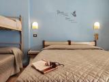 Standard Quadruple room with balcony and with partial sea view