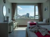 Standard Triple room with partial sea view