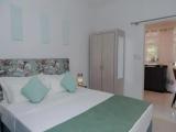 Standard Quadruple room with garden view