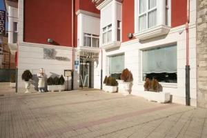 Hotel Asador H.M. Versus