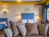 Standard Quadruple room with partial sea view