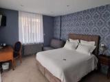 Standard Triple room with garden view