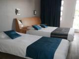 Standard Triple room with partial sea view