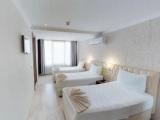 Standard Triple room with garden view