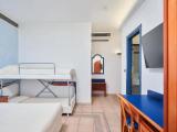 Standard Quadruple room with partial sea view
