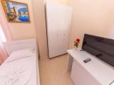 Standard Quadruple room with balcony and with partial sea view