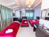 Superior Quadruple room with balcony and with partial sea view