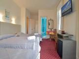 Standard Triple room with balcony and with partial sea view