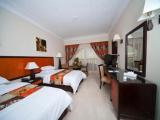 Standard Triple room with garden view