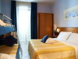 Standard Quadruple room with balcony and with partial sea view