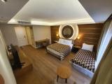 Standard Triple room with balcony and with partial sea view