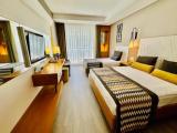 Standard Triple room with balcony and with partial sea view